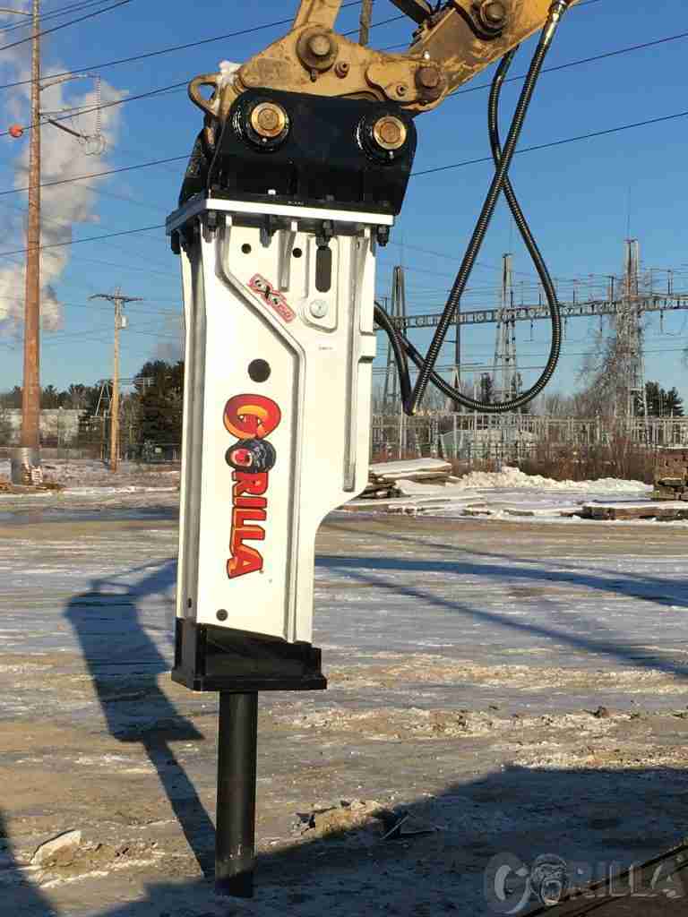 hydraulic breaker going to work breaking stone